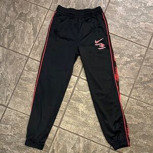 Nike Kids Black Joggers with Red Trim
